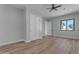 Well-lit bedroom with wood-look floors, a window, and closet at 26761 S 181St Pl, Queen Creek, AZ 85142