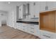 Modern kitchen with white cabinets and dark countertops at 26761 S 181St Pl, Queen Creek, AZ 85142