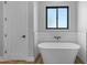 Relaxing bathroom with freestanding bathtub and subway tile at 26761 S 181St Pl, Queen Creek, AZ 85142