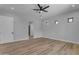 Spacious bedroom with wood-look floors and access to closet at 26761 S 181St Pl, Queen Creek, AZ 85142