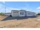 Modern home with a neutral color palette, clean lines, and large windows at 26761 S 181St Pl, Queen Creek, AZ 85142