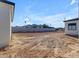 Large backyard with dirt and tire tracks, bordered by a block wall at 26761 S 181St Pl, Queen Creek, AZ 85142