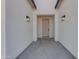 Modern home entry with light gray walls and doors at 26761 S 181St Pl, Queen Creek, AZ 85142