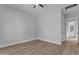 Light and airy bedroom with wood floors and access to bathroom at 26761 S 181St Pl, Queen Creek, AZ 85142