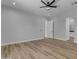 Light-filled bedroom featuring wood floors and modern door at 26761 S 181St Pl, Queen Creek, AZ 85142
