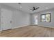 Bright living room with wood flooring and ceiling fan at 26761 S 181St Pl, Queen Creek, AZ 85142