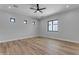 Bright bedroom with wood-look floors and ceiling fan at 26761 S 181St Pl, Queen Creek, AZ 85142