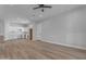 Open living space with wood floors and kitchen access at 26761 S 181St Pl, Queen Creek, AZ 85142