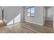 Bright bedroom with wood-look floors and a window at 26761 S 181St Pl, Queen Creek, AZ 85142