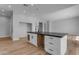 Open concept kitchen with white cabinets and island at 26761 S 181St Pl, Queen Creek, AZ 85142