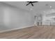 Spacious living room with wood floors and kitchen views at 26761 S 181St Pl, Queen Creek, AZ 85142