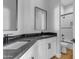 Modern bathroom with dark vanity and white cabinetry at 26761 S 181St Pl, Queen Creek, AZ 85142
