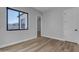 Spacious bedroom with wood-look floors and window at 26761 S 181St Pl, Queen Creek, AZ 85142