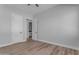 Bedroom with wood floors and access to a bathroom at 26761 S 181St Pl, Queen Creek, AZ 85142