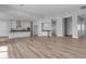 Open living area with kitchen and wood-like floor at 26761 S 181St Pl, Queen Creek, AZ 85142
