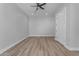 Spacious bedroom featuring wood-look floors and a ceiling fan at 26761 S 181St Pl, Queen Creek, AZ 85142