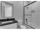 Modern bathroom with a shower/tub combo and dark vanity at 26761 S 181St Pl, Queen Creek, AZ 85142
