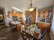 Kitchen with wooden cabinets, island, and dining area at 650 N Hawes Rd # 4507, Mesa, AZ 85207