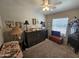 Bedroom with a murphy bed, ceiling fan, and ample closet space at 650 N Hawes Rd # 4507, Mesa, AZ 85207