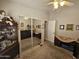 Bedroom with mirrored closet doors and neutral decor at 650 N Hawes Rd # 4507, Mesa, AZ 85207