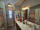 Bathroom with double vanity, large mirror, and a walk-in shower at 650 N Hawes Rd # 4507, Mesa, AZ 85207