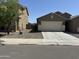 Two single-story homes with attached garages and desert landscaping at 10537 W Florence Ave, Tolleson, AZ 85353