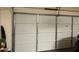 White garage door in a garage at 10537 W Florence Ave, Tolleson, AZ 85353