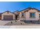 Beautiful Craftsman style home with a two car garage at 21711 E Roundup N Way, Queen Creek, AZ 85142