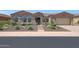 One-story home with a landscaped front yard and a large driveway at 12349 W Tyler Trl, Peoria, AZ 85383