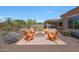 Relaxing backyard with fire pit and landscaping, perfect for outdoor living at 12349 W Tyler Trl, Peoria, AZ 85383