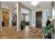 Open entryway with tile floors, and views into living room and hallway at 12349 W Tyler Trl, Peoria, AZ 85383