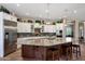 Gourmet kitchen with granite countertops, stainless steel appliances, and large island at 12349 W Tyler Trl, Peoria, AZ 85383