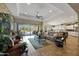 Open living space with access to backyard and kitchen at 12349 W Tyler Trl, Peoria, AZ 85383