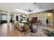 Spacious living area with tile floors, stone feature wall, and ample natural light at 12349 W Tyler Trl, Peoria, AZ 85383