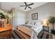 Spacious main bedroom with a ceiling fan and large closet at 12349 W Tyler Trl, Peoria, AZ 85383