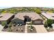 Aerial view of a house with a tile roof and a landscaped yard at 12349 W Tyler Trl, Peoria, AZ 85383
