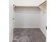 Spacious walk-in closet with wood shelving and carpeting at 2302 N Central N Ave # 302, Phoenix, AZ 85004