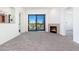 Living room featuring a fireplace and balcony access at 2302 N Central N Ave # 302, Phoenix, AZ 85004