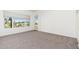 Bedroom with large window, carpet flooring, and patio access at 2302 N Central N Ave # 302, Phoenix, AZ 85004