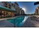 Relaxing community pool with lounge chairs at 2302 N Central N Ave # 302, Phoenix, AZ 85004