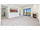 Bright living room with fireplace and access to a balcony at 2302 N Central N Ave # 302, Phoenix, AZ 85004