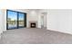 Spacious living area with fireplace and sliding glass doors at 2302 N Central N Ave # 302, Phoenix, AZ 85004
