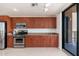 Kitchen boasts stainless steel appliances and wood cabinetry at 2302 N Central N Ave # 302, Phoenix, AZ 85004