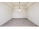 Bright dining room with neutral carpeting and a ceiling light fixture at 2302 N Central N Ave # 302, Phoenix, AZ 85004