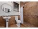 Bathroom with shower stall, toilet, and pedestal sink at 2127 E Huntington Dr, Phoenix, AZ 85040