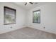 Spacious bedroom with two windows and carpeted floor at 2127 E Huntington Dr, Phoenix, AZ 85040