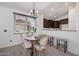 Bright dining area with a kitchen pass-through and beautiful chandelier at 2127 E Huntington Dr, Phoenix, AZ 85040