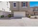 Townhouse exterior with white garage door at 2127 E Huntington Dr, Phoenix, AZ 85040