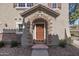 Inviting house entrance with stone accents and a wood door at 2127 E Huntington Dr, Phoenix, AZ 85040