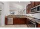 Modern kitchen with stainless steel appliances and granite countertops at 2127 E Huntington Dr, Phoenix, AZ 85040